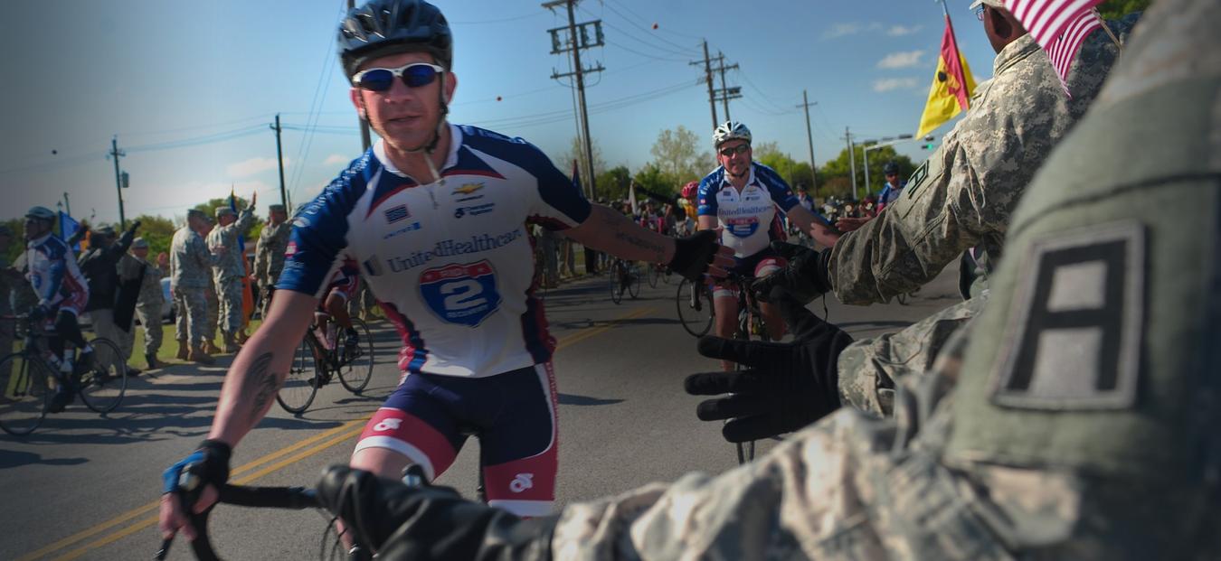 Soldiers, civilians and Family members from Division West, First Army, cheer Healing Heroes and other cyclists during the annual Texas Challenge event of the Ride to Recovery at Fort Hood, TX Apr 11. Photo by Sgt 1st Class Gail Braymen, Division West, Public Affairs / U.S. Army