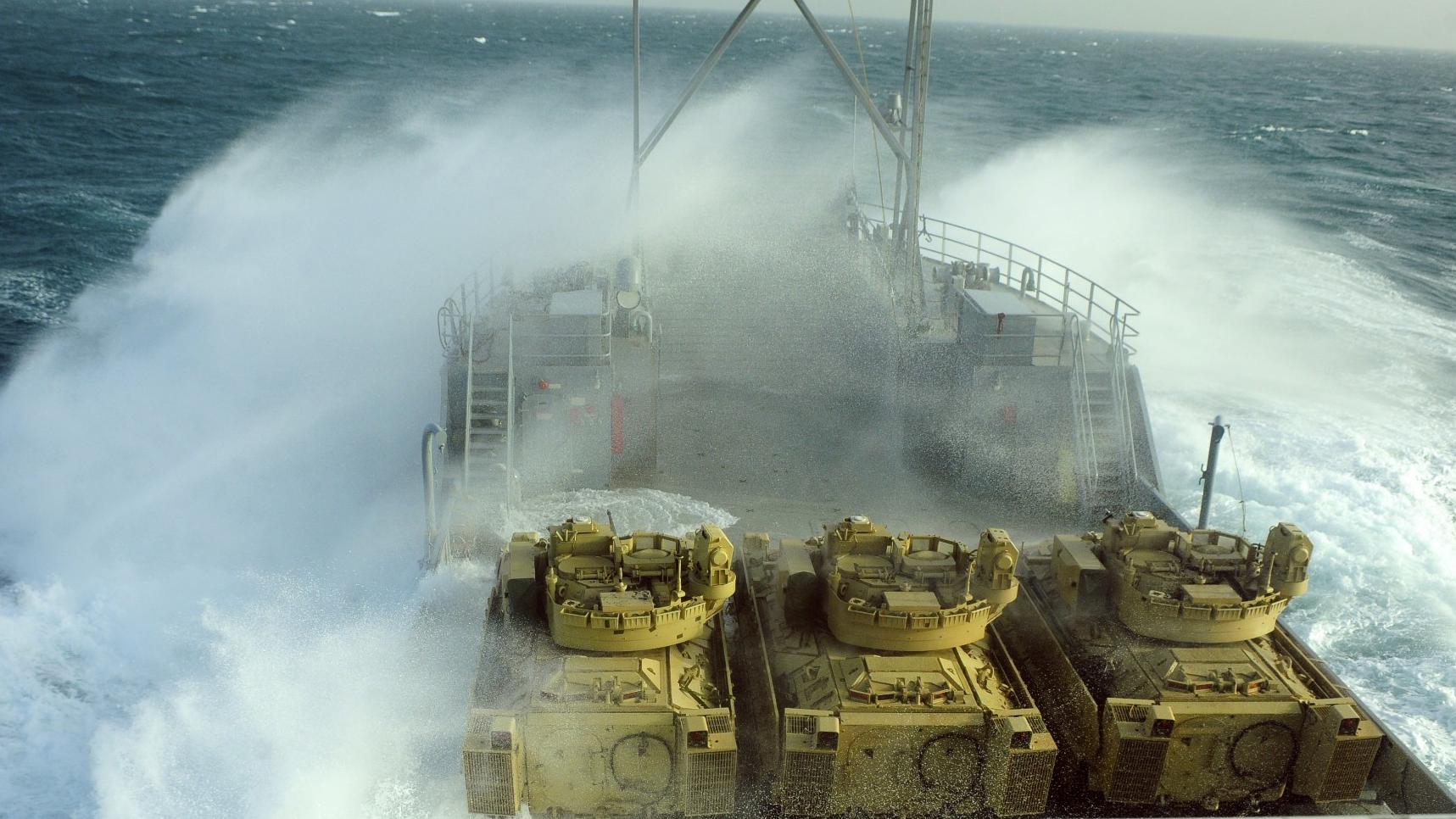 Waves crash over the side of U.S. Army Vessel Churubusco in the Persian Gulf Jan. 9 during the training mission Operation Spartan Mariner.