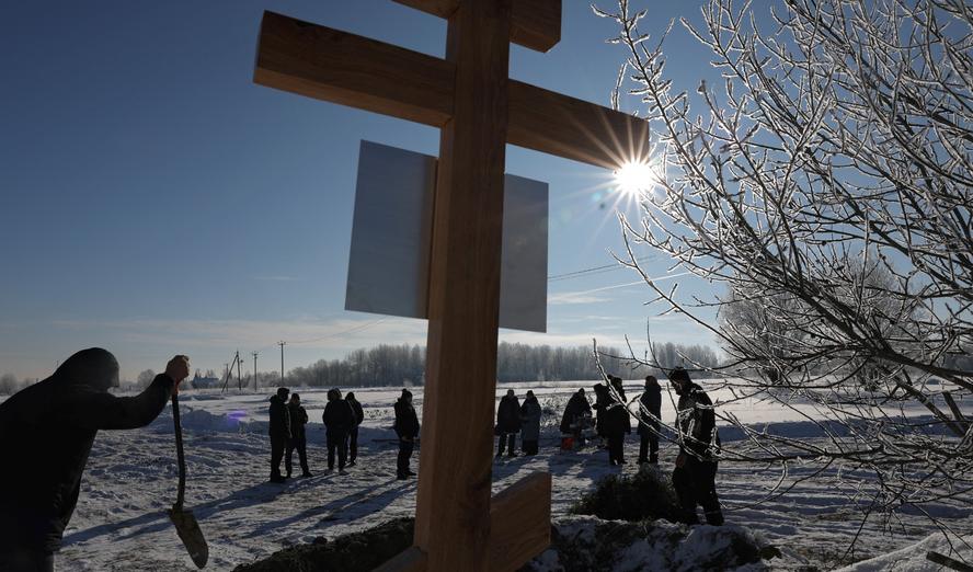 People attend the funeral of Vladimir Pozdnyakov, a junior sergeant of the Russian armed forces who was killed in the Russia-Ukraine conflict, in the village of Orzhitsy, Leningrad region, Russia, February 18, 2026